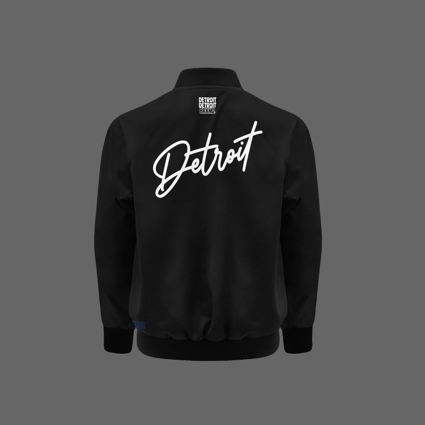 Black kids bomber jacket with “Detroit” written in bold white script across the chest, featuring a gold zipper and ribbed cuffs and hem.