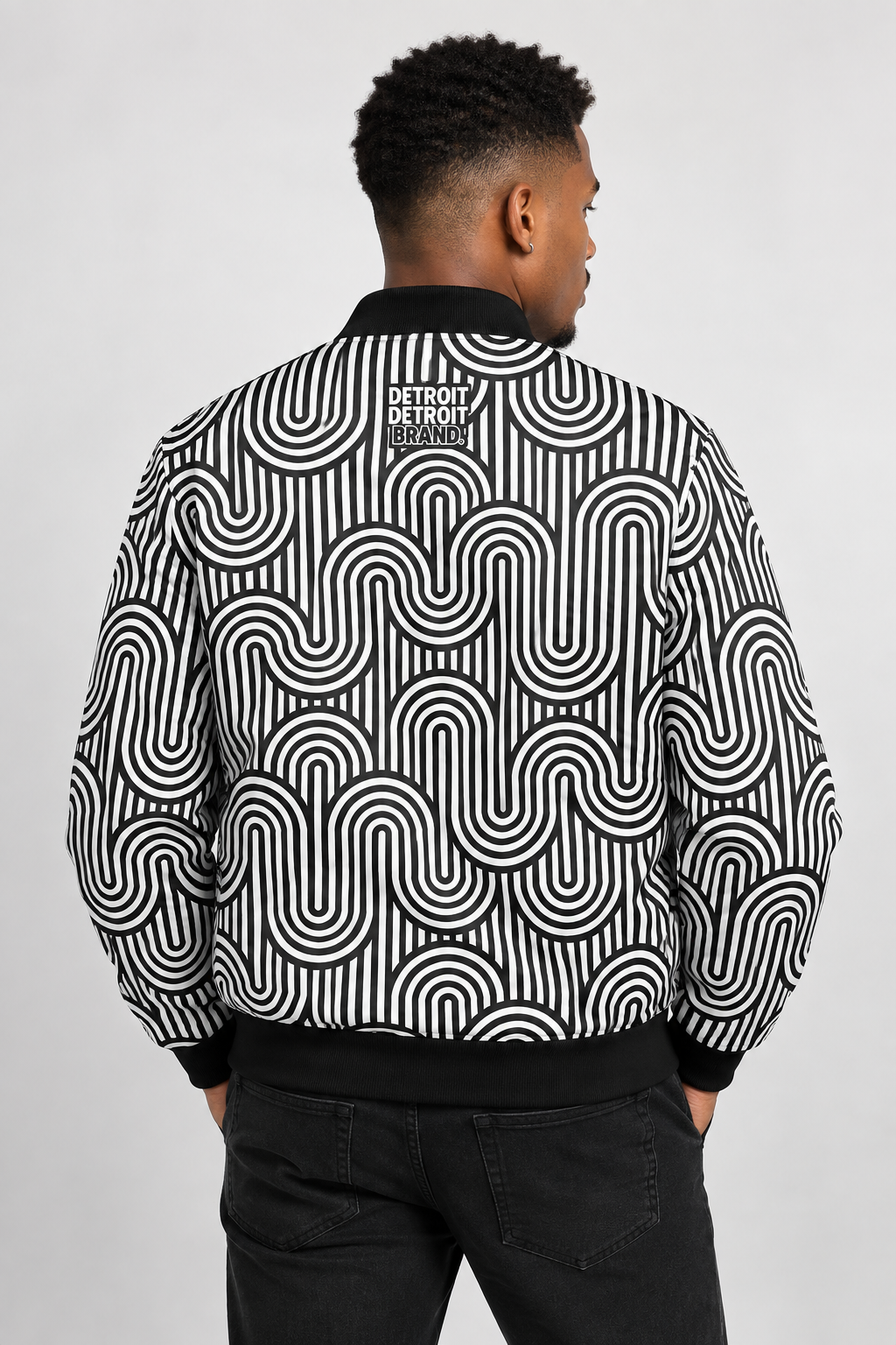 Model wearing the Detroit Monochrome Pattern bomber jacket, back view