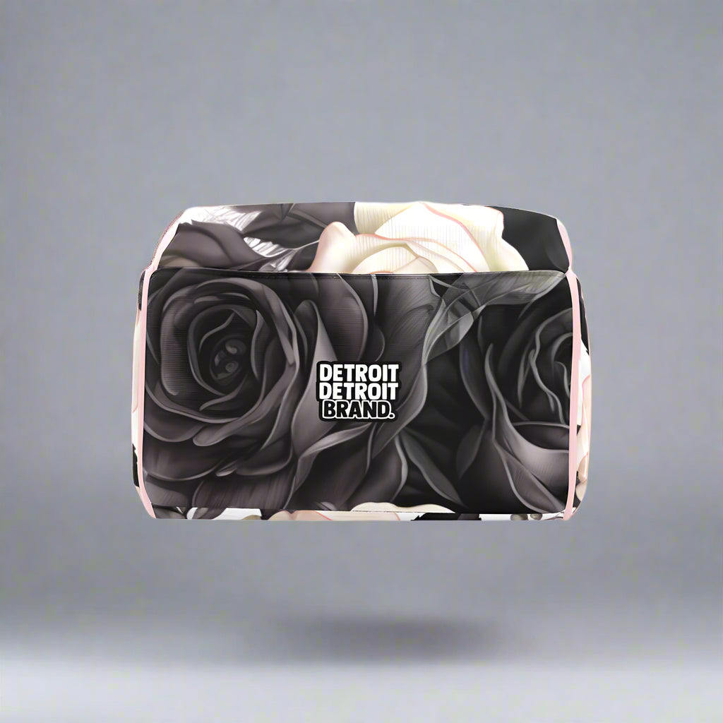 Rectangular product with black and white rose design and 'Detroit Brand' logo on a white background
