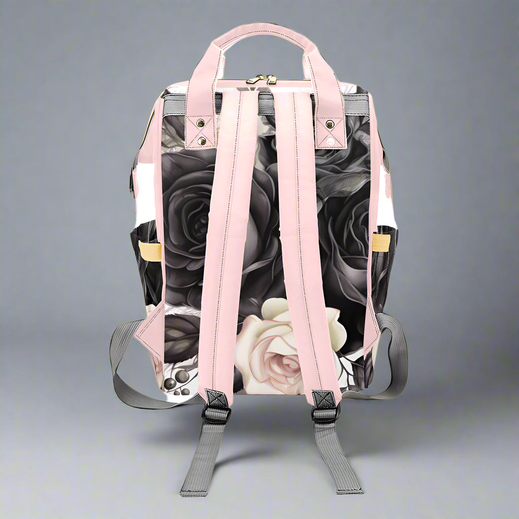 Backpack with floral design and pink straps on a white background