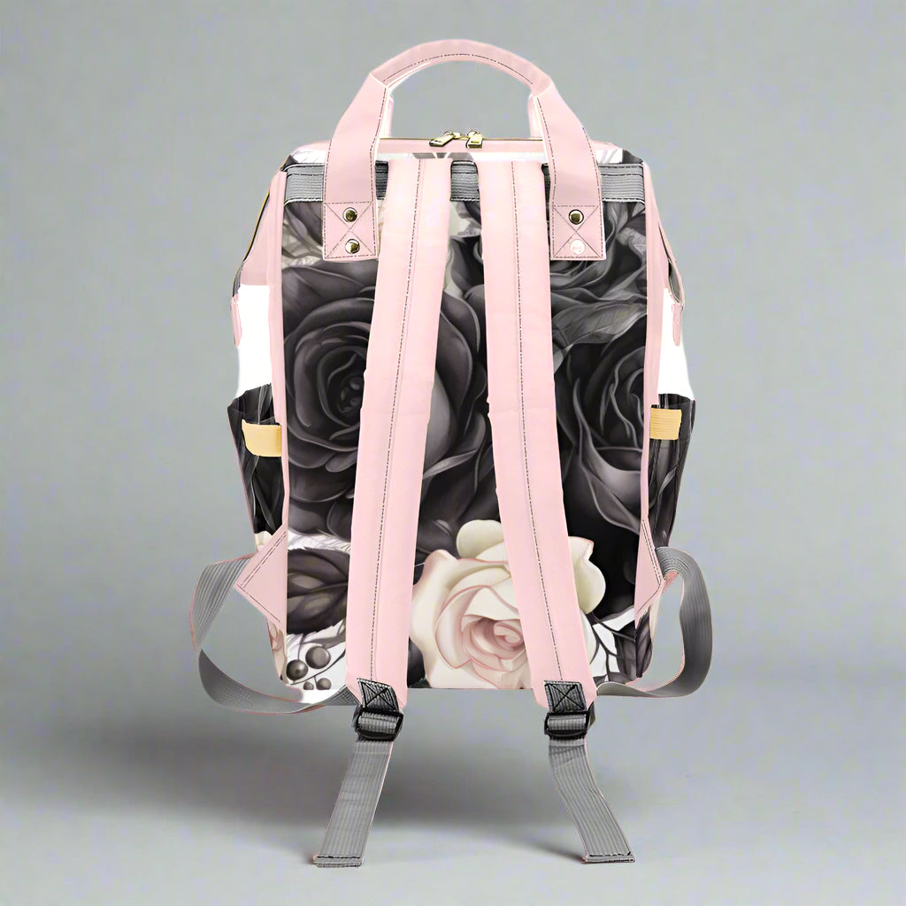 Backpack with floral design and pink straps on a white background