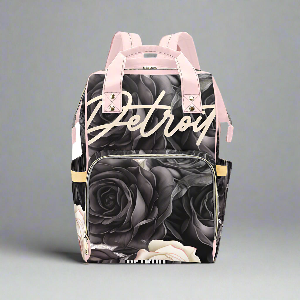 Backpack with rose pattern and 'Detroit' text on a white background