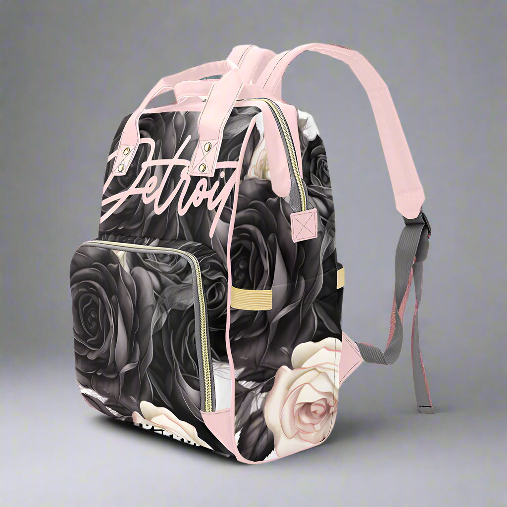 Backpack with black and white floral design and 'Detroit' text on a white background