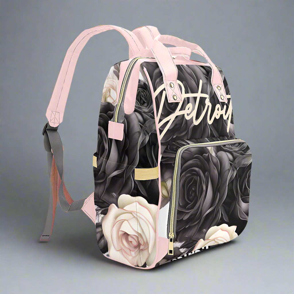 Backpack with floral design and 'Detroit' text on a white background