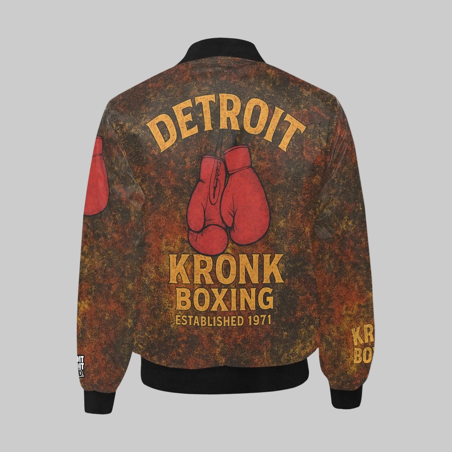 Vintage-style jacket with 'Detroit Kronk Boxing' text and boxing glove graphics on a gray background