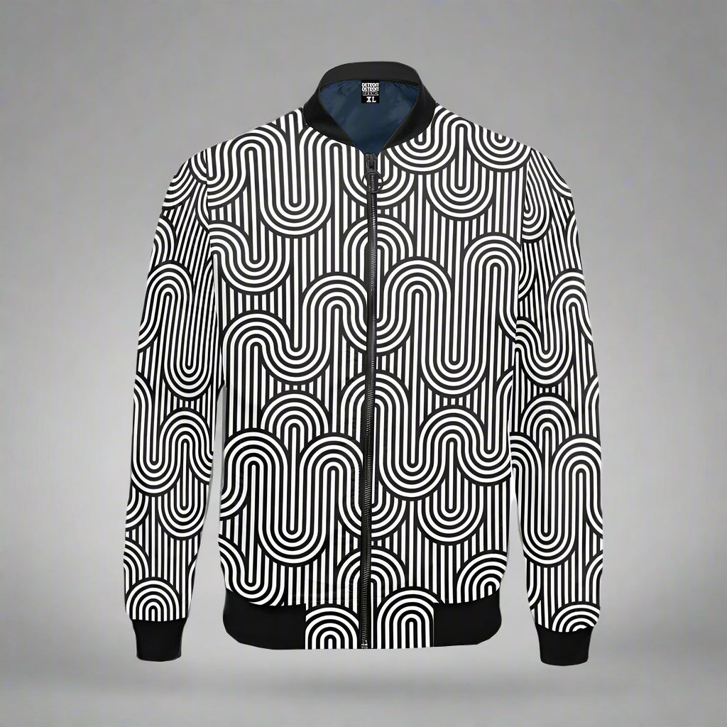 Black and white zip-up bomber jacket displayed flat against a gray background. The jacket features a bold, geometric pattern with vertical stripes and interlocking curved lines forming a repeating abstract design. It has black ribbed cuffs, waistband, and collar, along with a black zipper down the front.