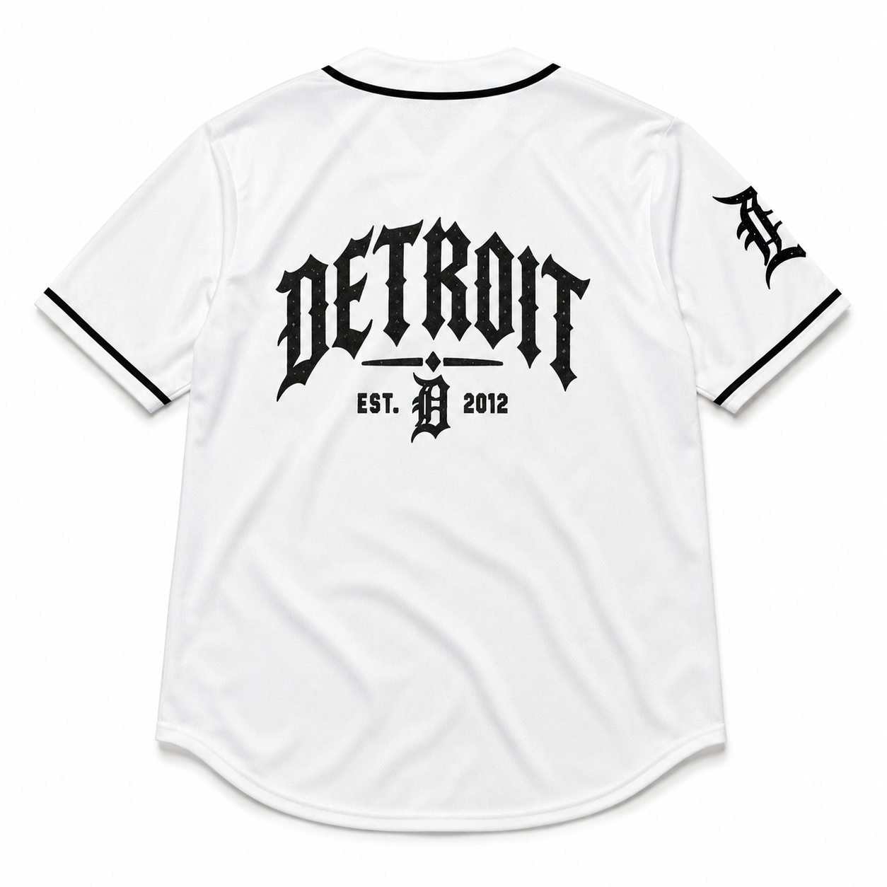 White Detroit Tigers baseball jersey shown from the back, featuring a large black gothic 'DETROIT' logo and 'EST. D 2012' text on the center back, with a black 'D' logo on the sleeve.
