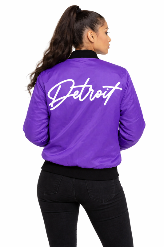 Person wearing a purple jacket with 'Detroit' written on the back, on a white background