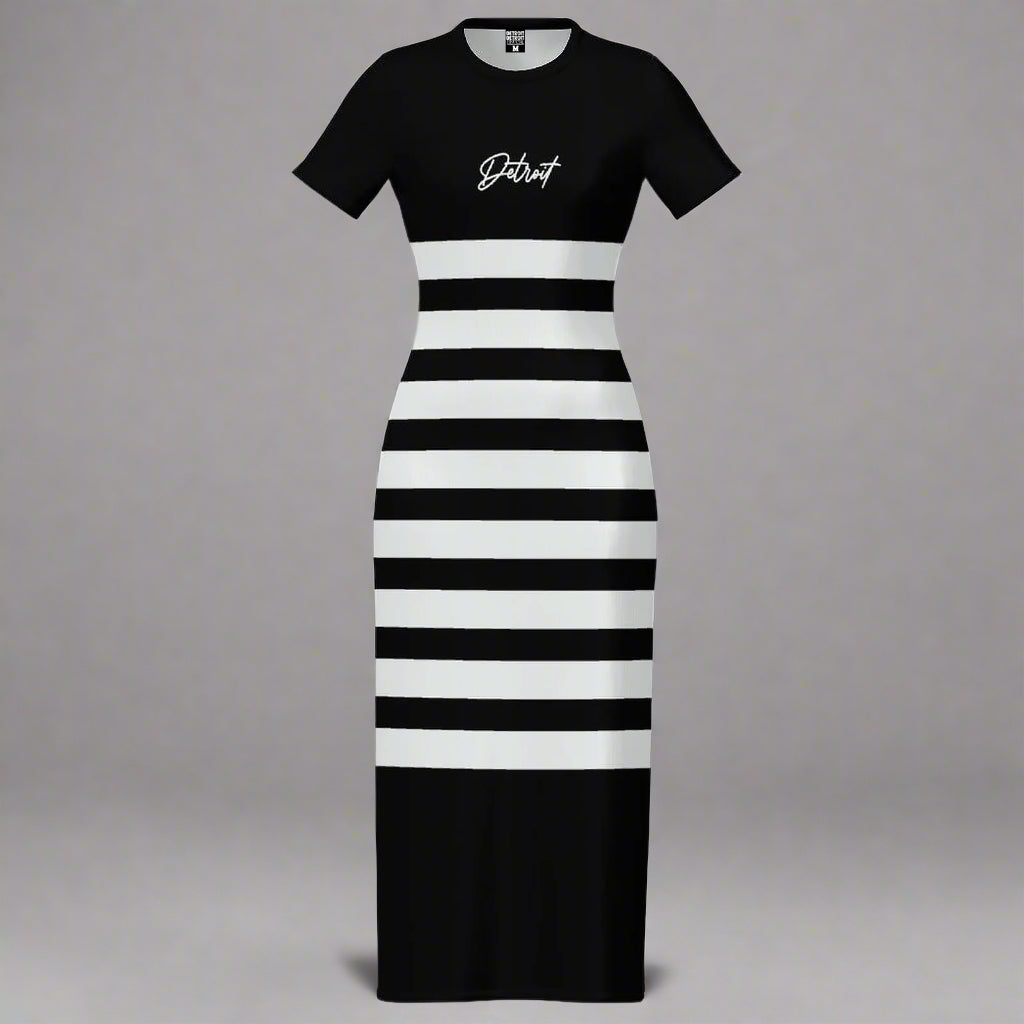 Black and white striped maxi dress displayed flat against a gray background. The dress has short sleeves and features a solid black top with the word 'Detroit' printed in white cursive text on the chest. The lower portion of the dress consists of alternating horizontal black and white stripes, creating a bold, modern look.