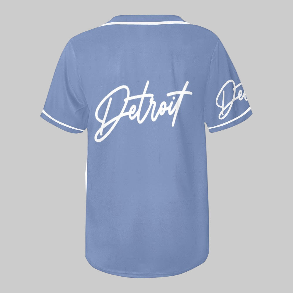 Light blue baseball jersey with white button-up front, white trim, and “Detroit” written in white script on the chest and sleeve.