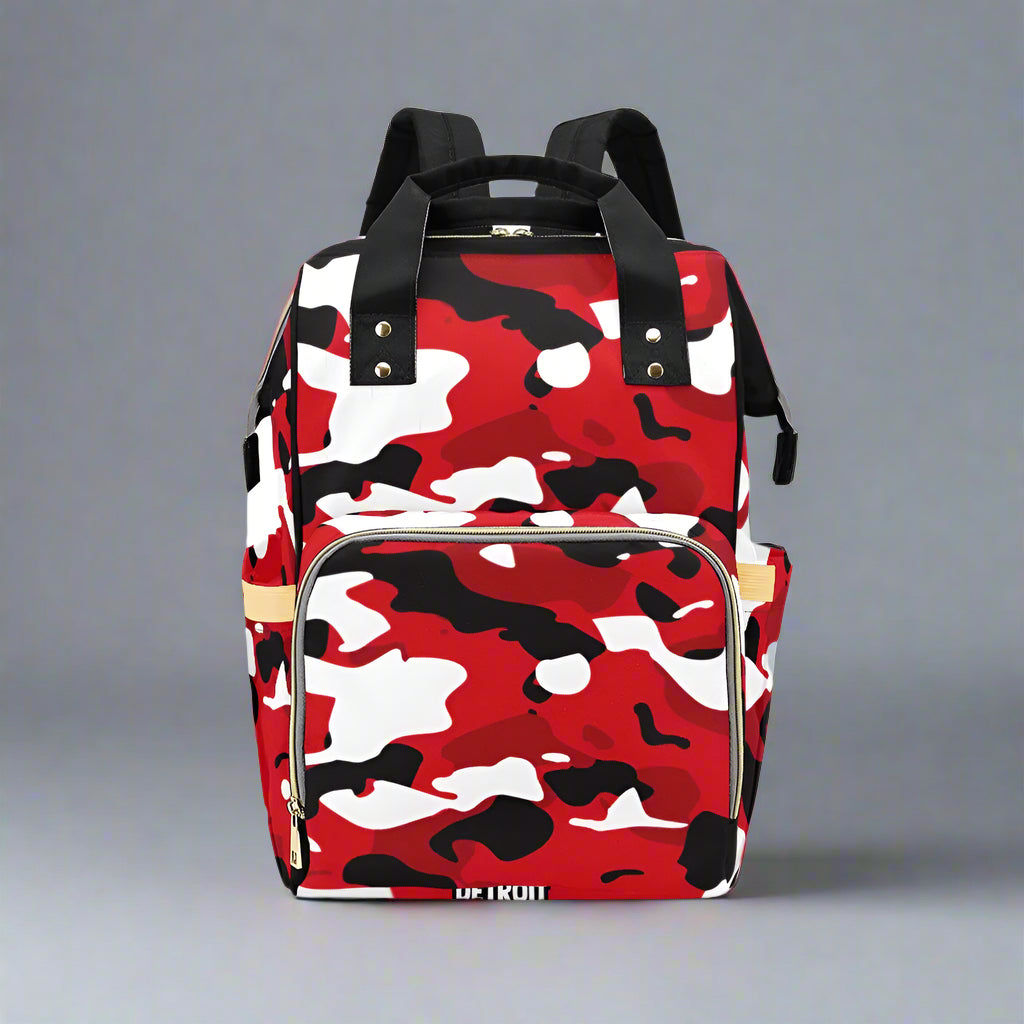 Red, black, and white camouflage backpack on a white background