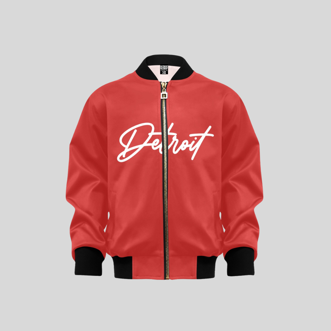 Red kids bomber jacket with “Detroit” written in bold white script across the chest, featuring a gold zipper and black ribbed collar, cuffs, and hem.