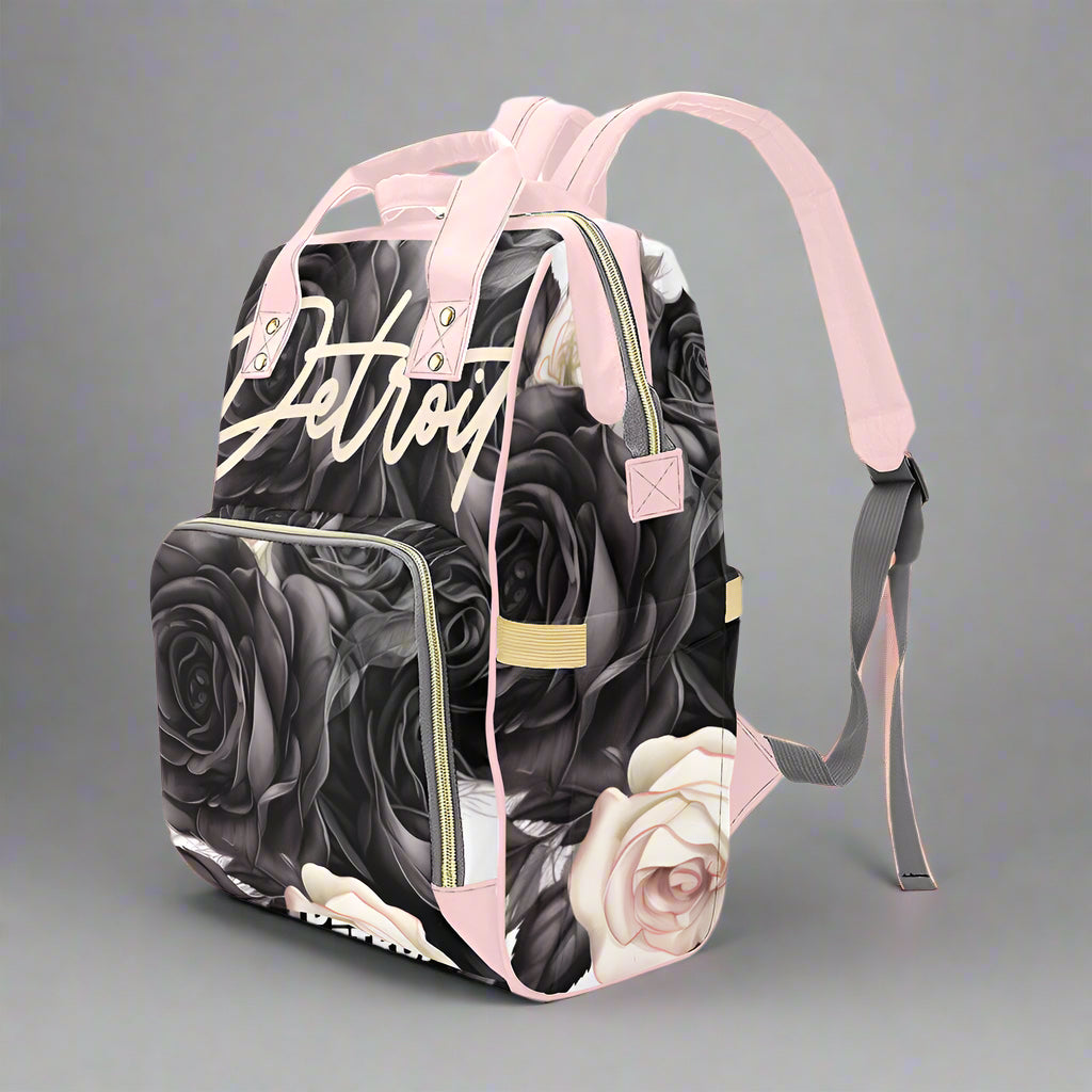 Backpack with black roses and 'Detroit' text on a white background