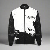 Black and white Detroit ‘Born and Raised’ splash-design bomber jacket with full front zipper and monochrome streetwear style