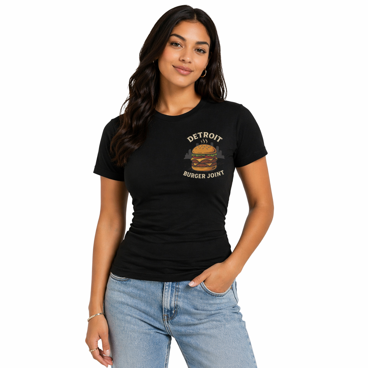Female model wearing a fitted black Detroit Burger Joint graphic t-shirt with burger logo, styled with light blue jeans on a clean white studio background
