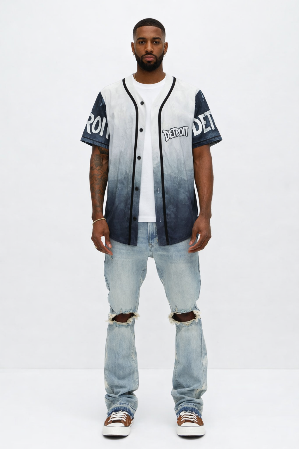 Man wearing Detroit grey and black baseball jersey with gradient design, styled with ripped jeans and sneakers, full body front view