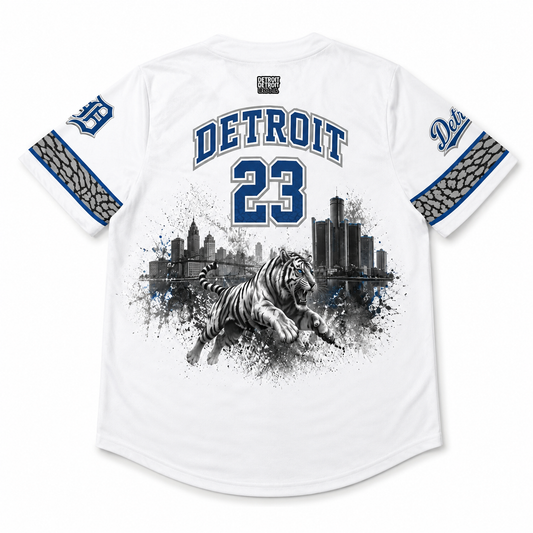Flat lay of the back of the Detroit Heritage White & Blue Baseball Jersey featuring the Detroit skyline, tiger artwork, Old English D sleeve logo, and number 23.