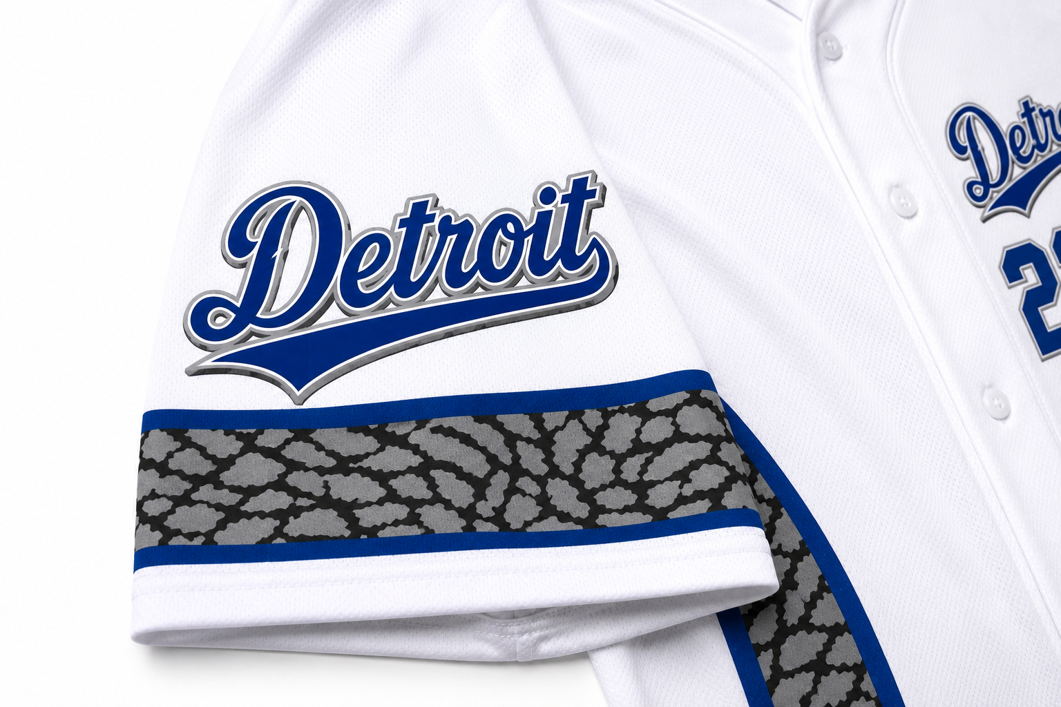 Close-up of the Detroit script logo, elephant-print sleeve trim, and premium fabric texture on the Detroit Heritage Baseball Jersey.