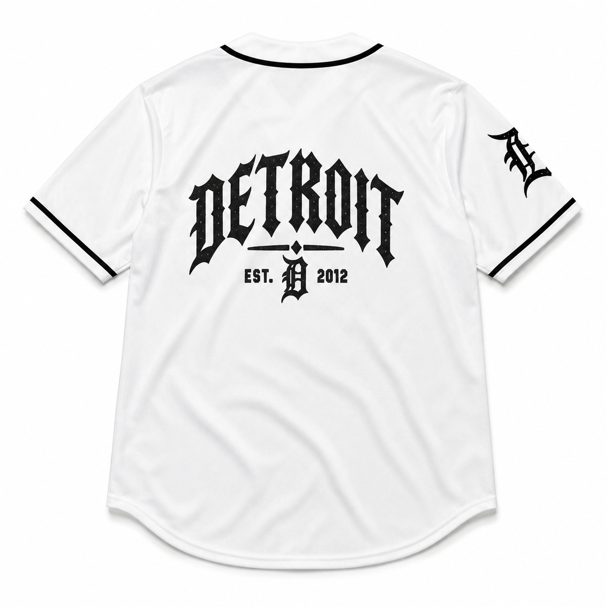 White Detroit Tigers baseball jersey shown from the back, featuring a large black gothic 'DETROIT' logo and 'EST. D 2012' text on the center back, with a black 'D' logo on the sleeve.