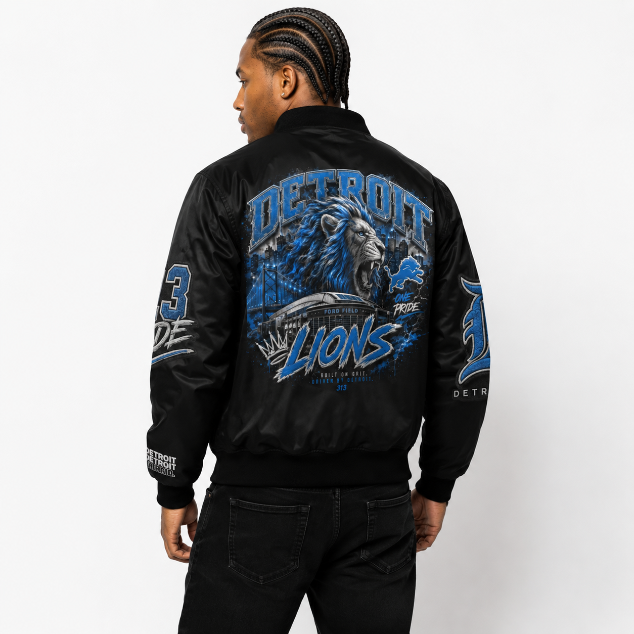 Male model wearing the black Detroit Lions bomber jacket from the back, featuring Detroit, lion, Ford Field and blue graphic details