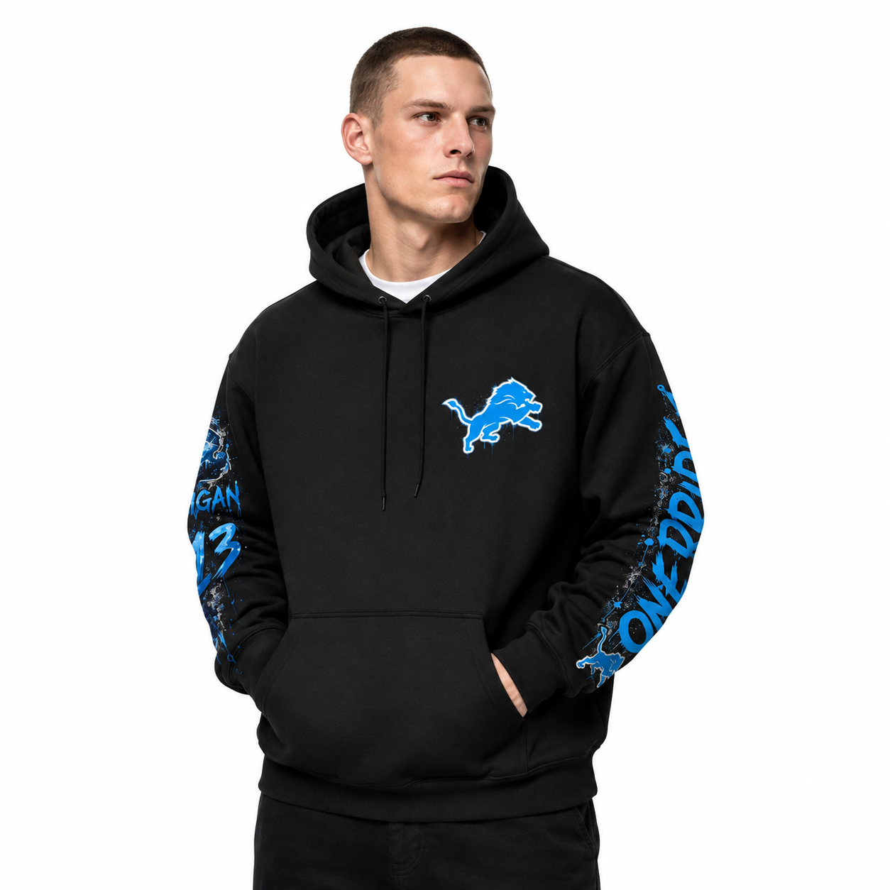 Male model wearing a black Detroit Lions-inspired One Pride hoodie with Honolulu blue chest and sleeve graphics on a white studio background.