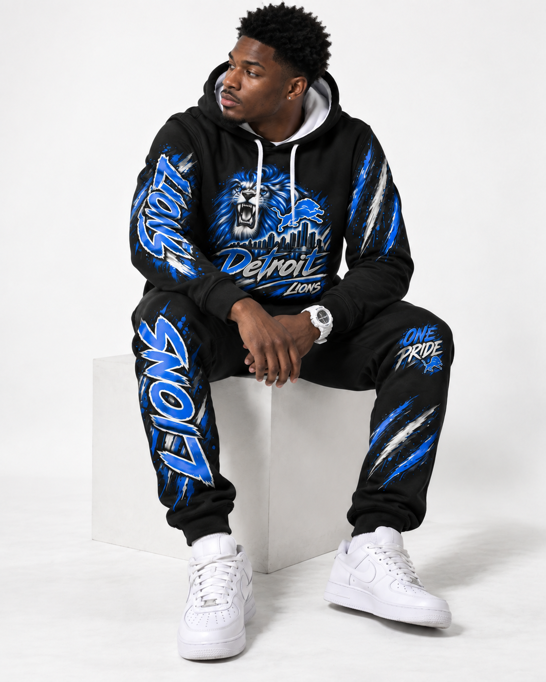 Male model looking away while wearing Detroit One Pride polyester hoodie and jogger set