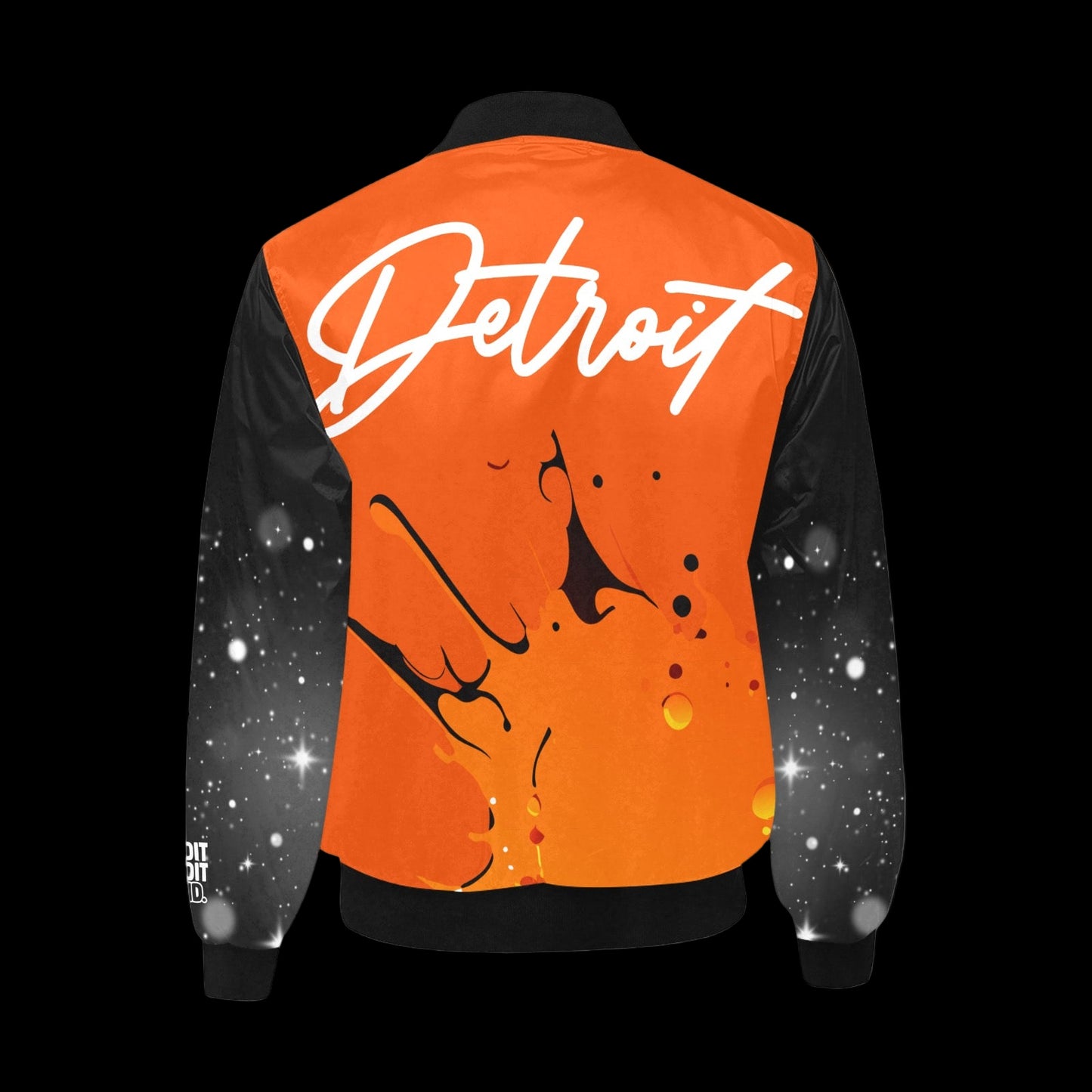 Back view of an orange Detroit bomber jacket with white script logo, black sleeves with white splatter design, and abstract orange splash graphic on the back