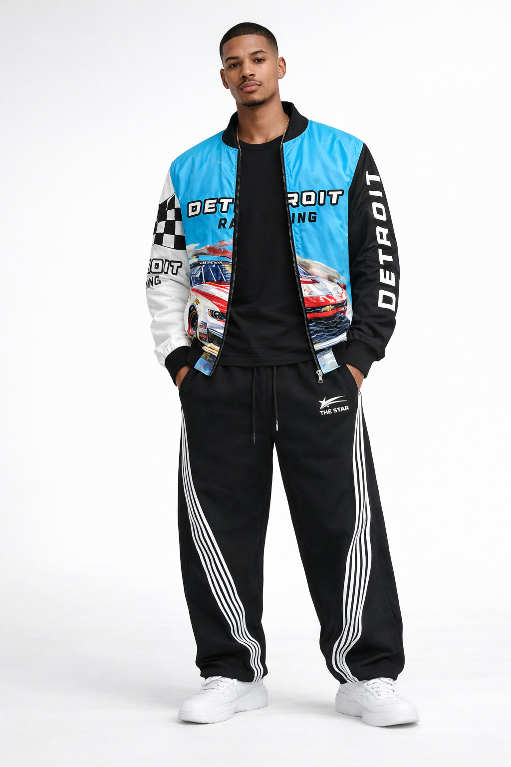 Front view of men’s Detroit Racing bomber jacket worn unzipped with black t-shirt, black track pants, and white sneakers on white studio background