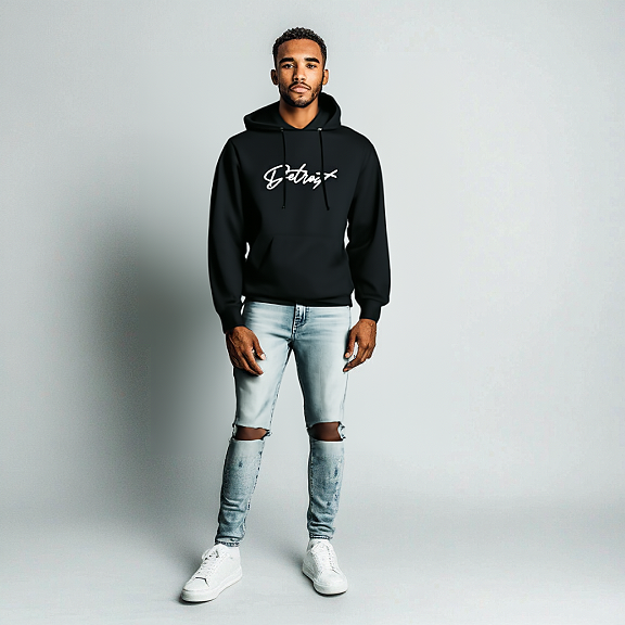 Man wearing a black hoodie with white “Detroit” script logo on the chest, paired with light blue ripped jeans and white sneakers, standing against a light gray background.