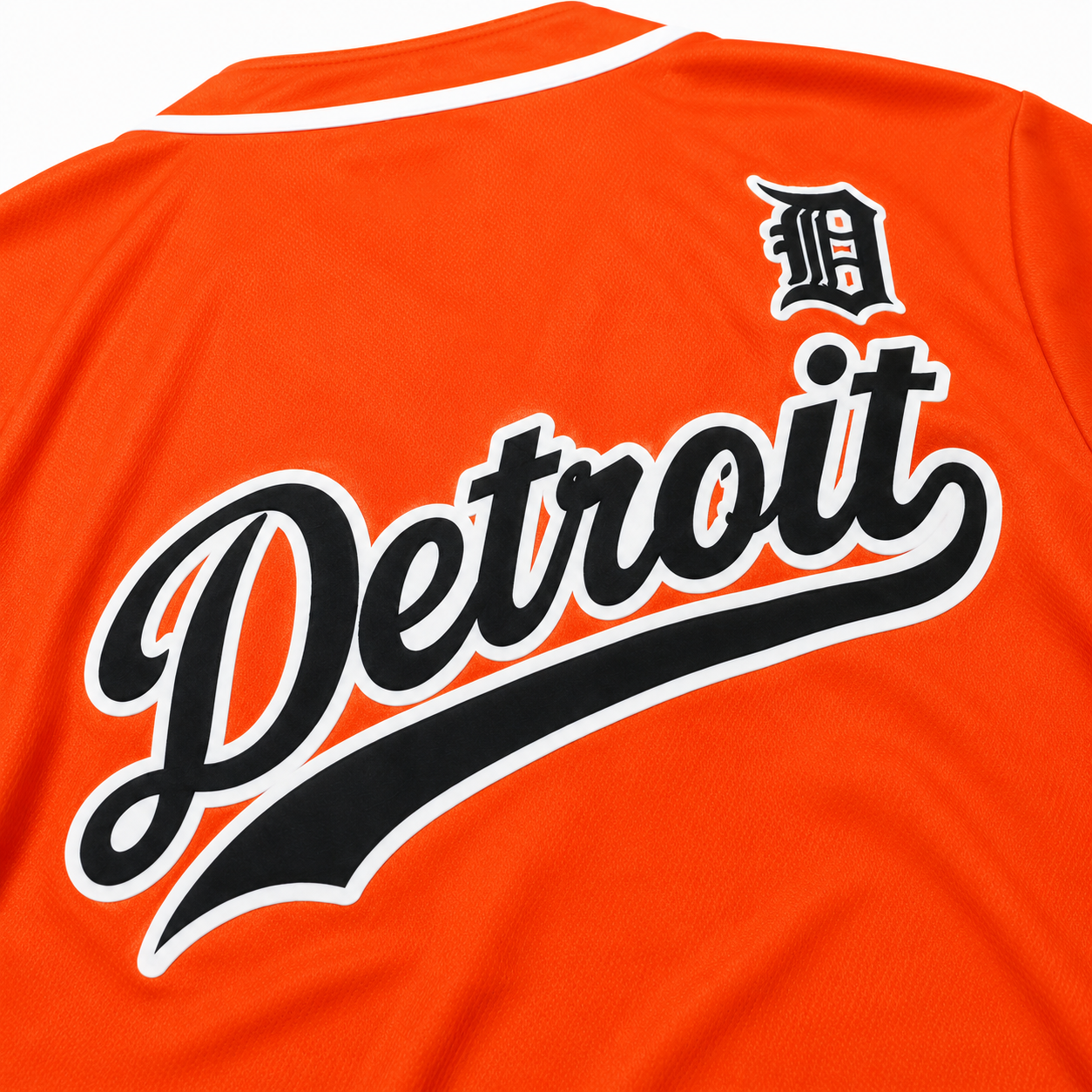 Close-up of the back of the Detroit Script Orange Baseball Jersey highlighting the oversized Detroit script graphic, Old English D logo, and breathable mesh fabric.