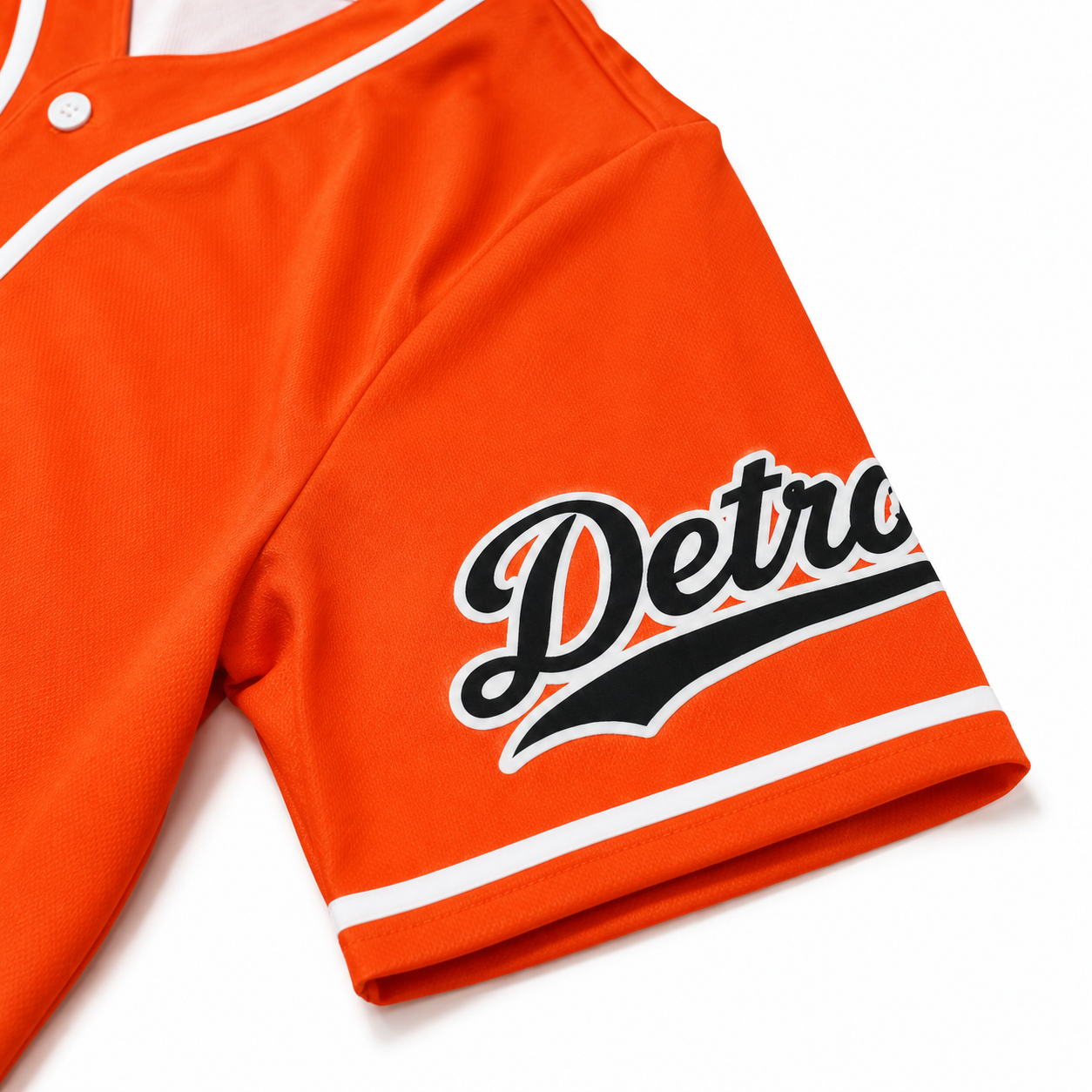 Close-up of the Detroit Script Orange Baseball Jersey sleeve featuring Detroit script graphic, white piping, and premium stitching.