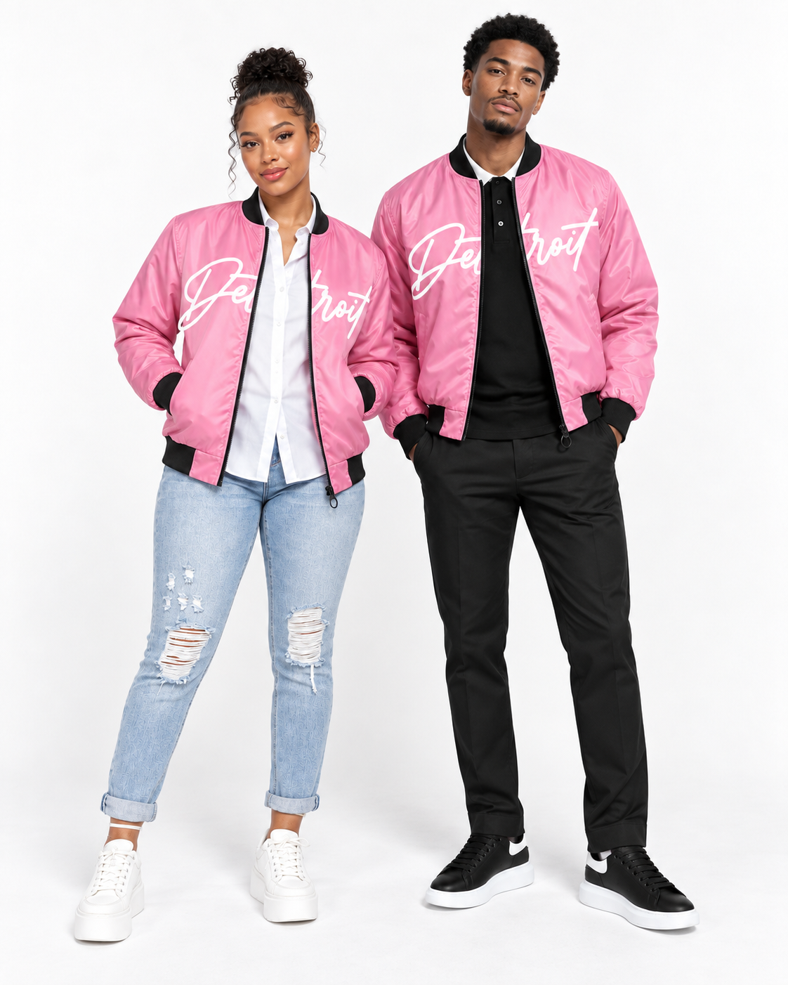 Male and female models wearing matching Detroit Script pink bomber jackets