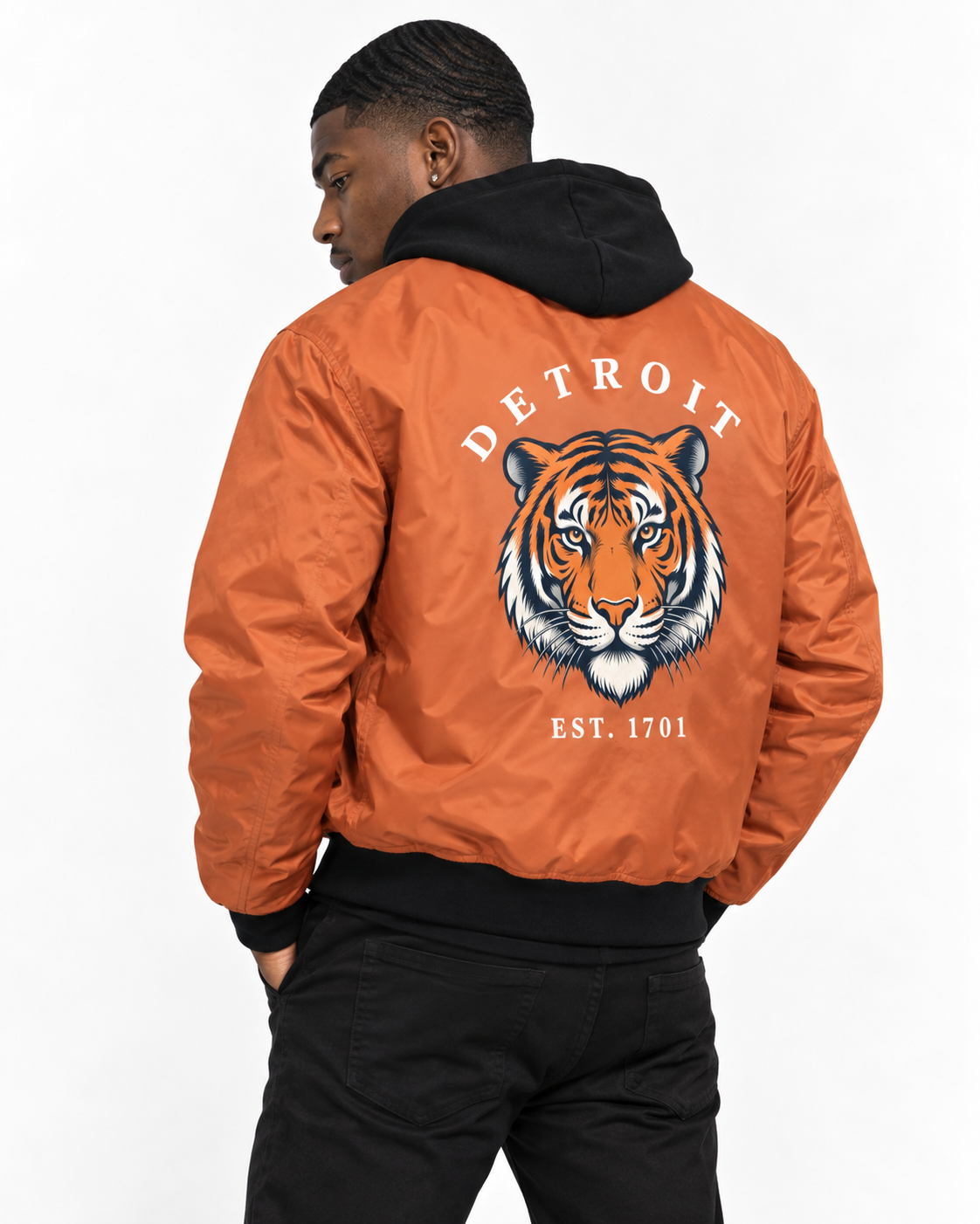 Angled back view of orange Detroit Tiger 1701 bomber jacket on male model