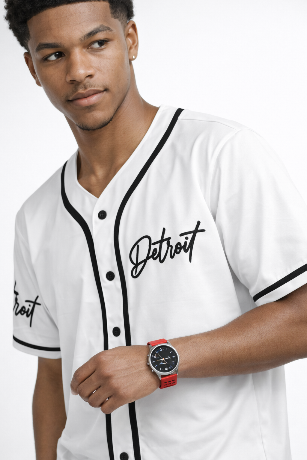 Close-up front view of men’s white Detroit baseball jersey with black piping and Detroit script logo detail
