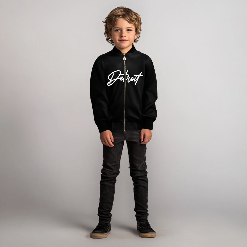 Child wearing a black hoodie with 'Detroit' text on a plain background